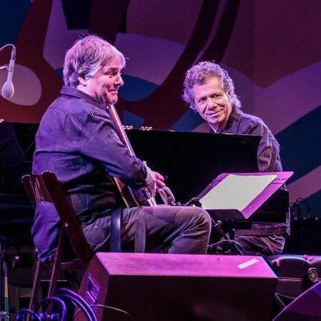 Béla Fleck with guitar and Chick Corea on piano, performing on stage at MJF