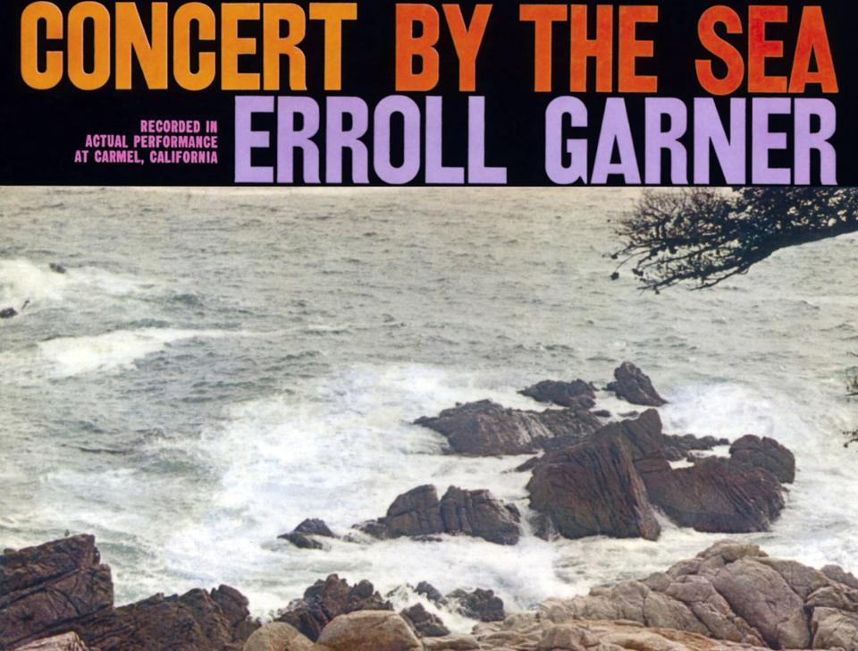 Live album cover of 'Concert by the Sea' by Erroll Garner. Rocky coastline meeting the ocean is under the album title.