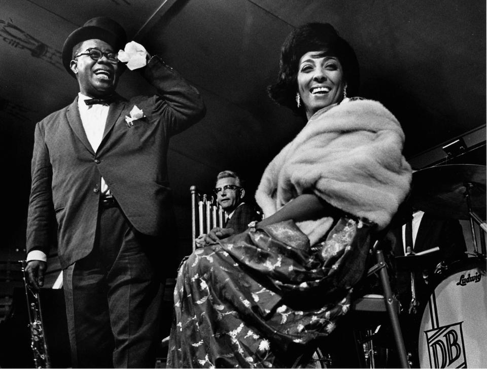 Louis Armstrong and Carmen McRae on stage, in black and white