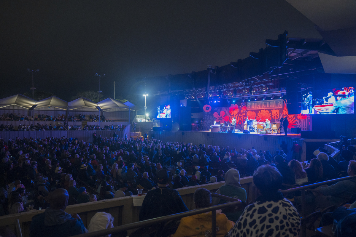 The Monterey Jazz Festival Arena stage at night with the audience in front watching a performance