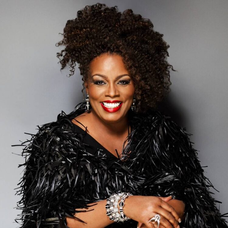 Dianne Reeves in front of a grey background