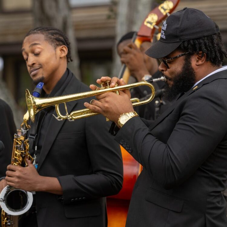 Members of the HBCU program performing on stage