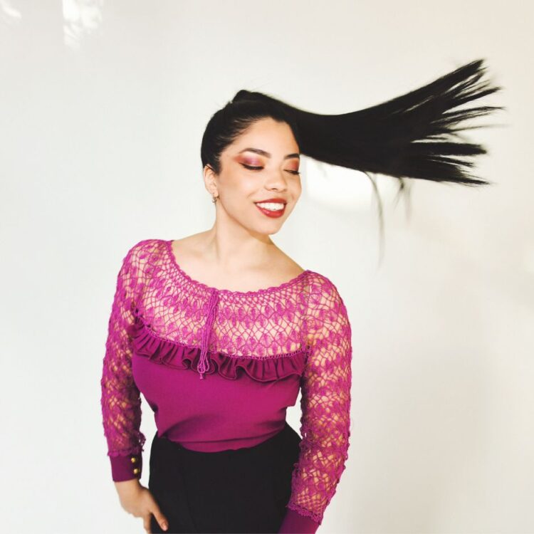 Lucía standing in front of the white background