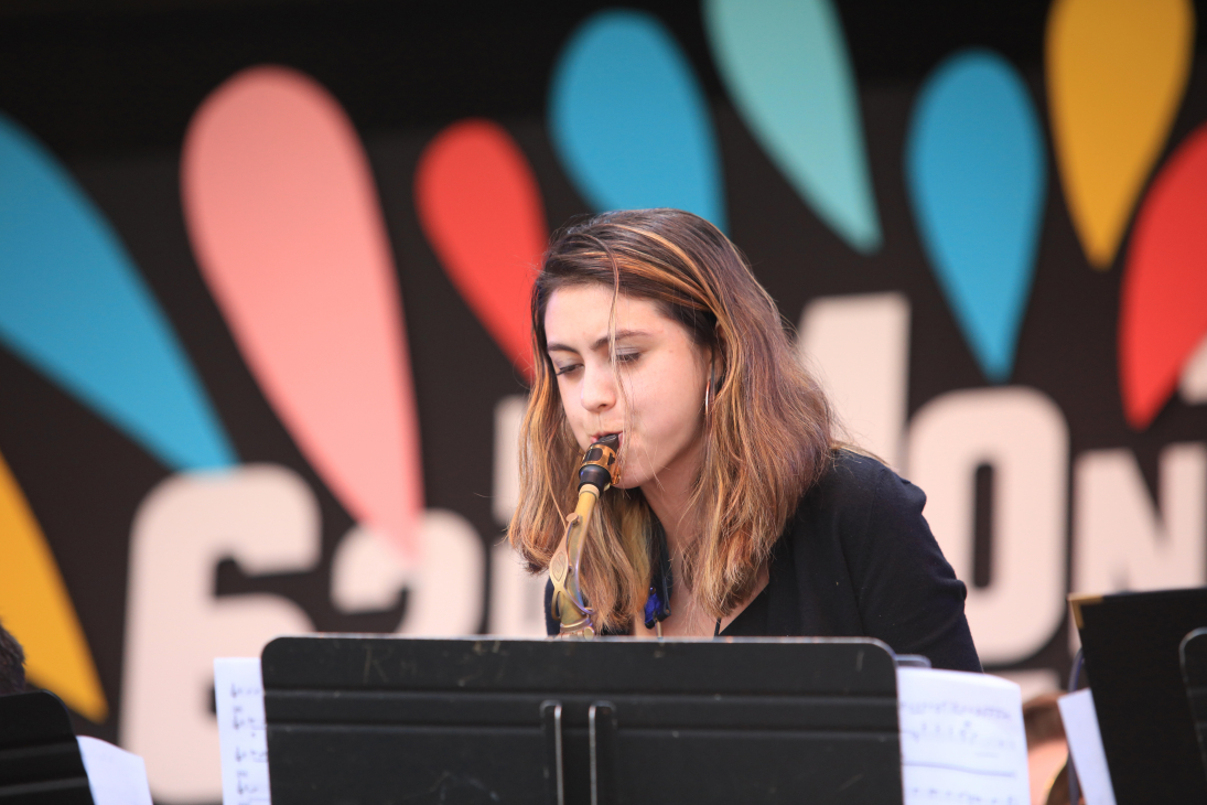 Veronica Leahy performing her saxophone on stage at MJF 62