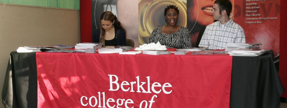A Berklee College of Music information booth with 3 people
