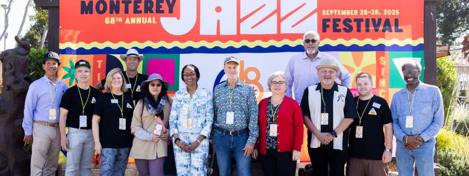 A group of people in front of a sign