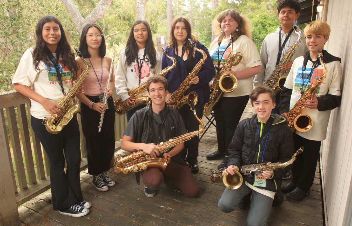 a group of musicians with saxophones