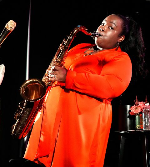 Camille Thurman playing Saxophone on stage