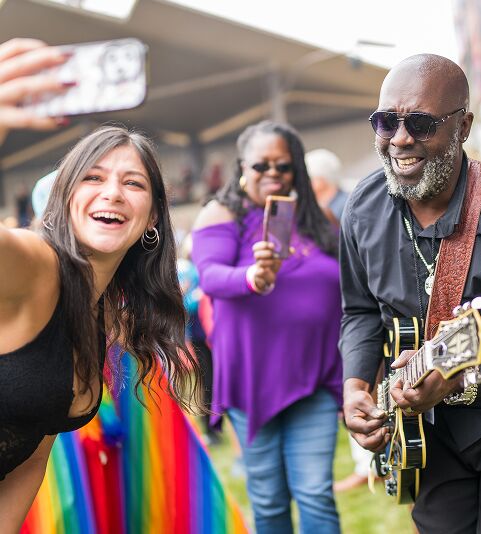 Audience members taking a photo with Mr Sipp