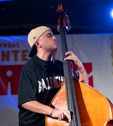 Bassist performing on stage