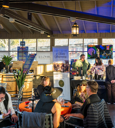 Inside of the Premier Club with attendees sitting at tables