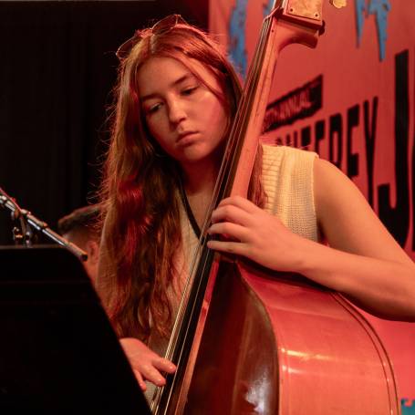 A woman playing the bass