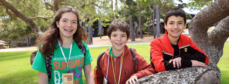 Three summer Jazz camp students outside