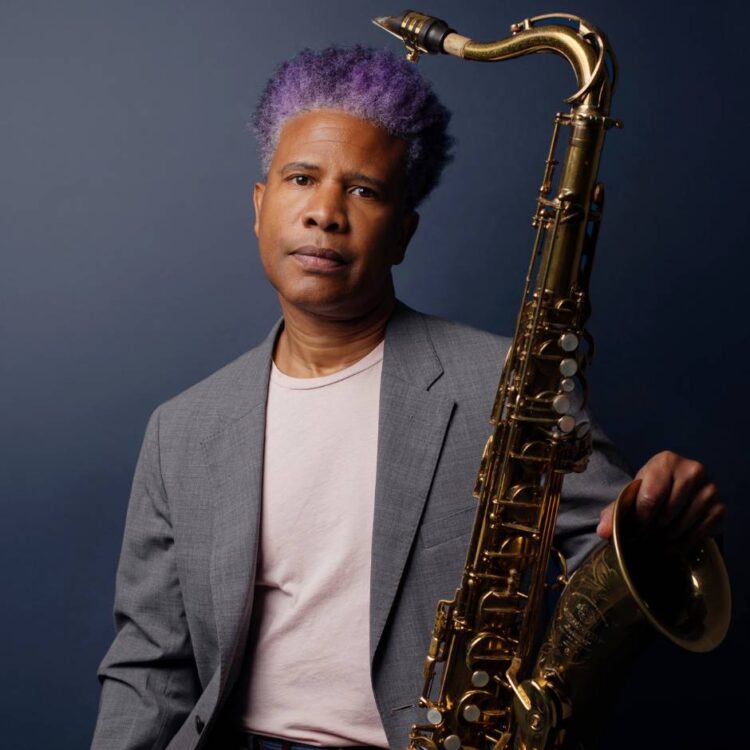 A man holding a saxophone