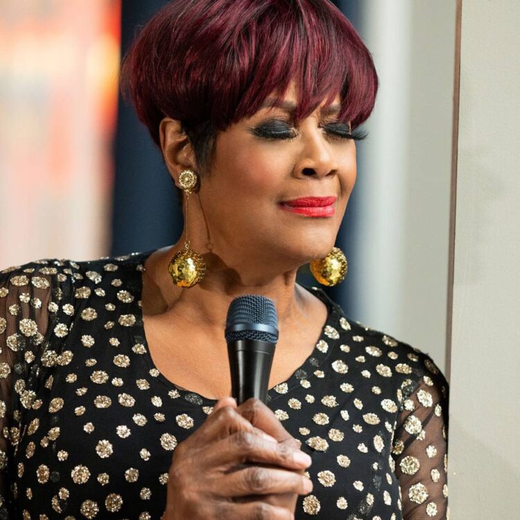 A woman holding a microphone