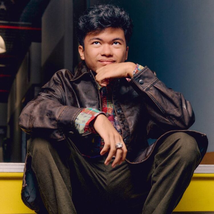 A man sitting on stairs