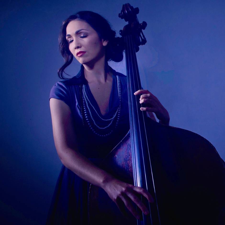 A woman playing bass