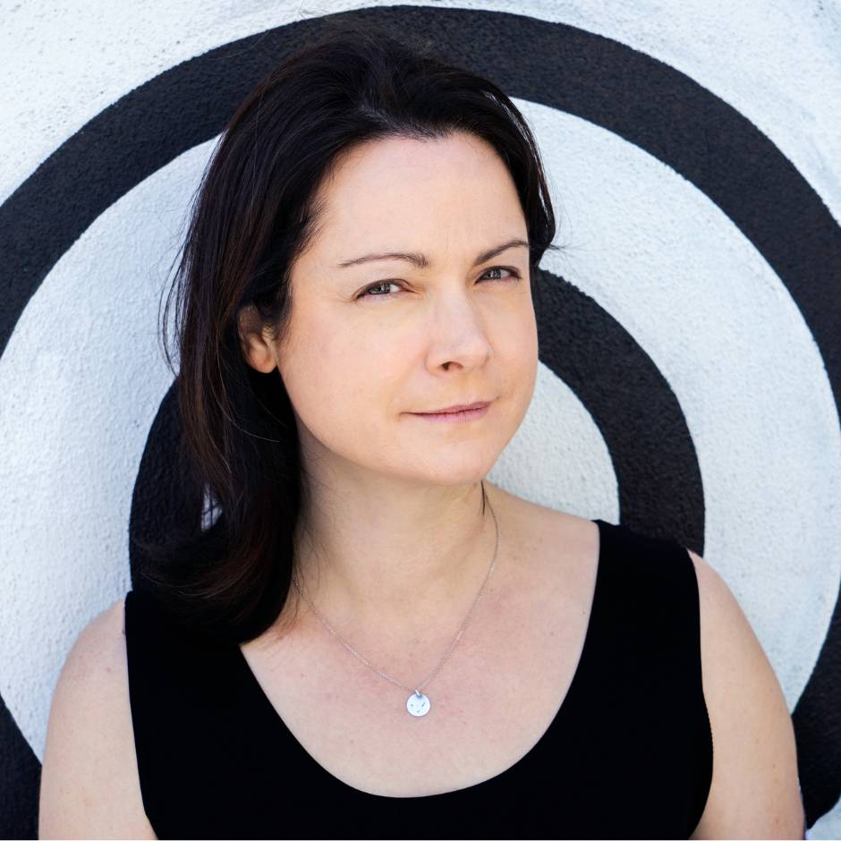 A woman in front of a wall