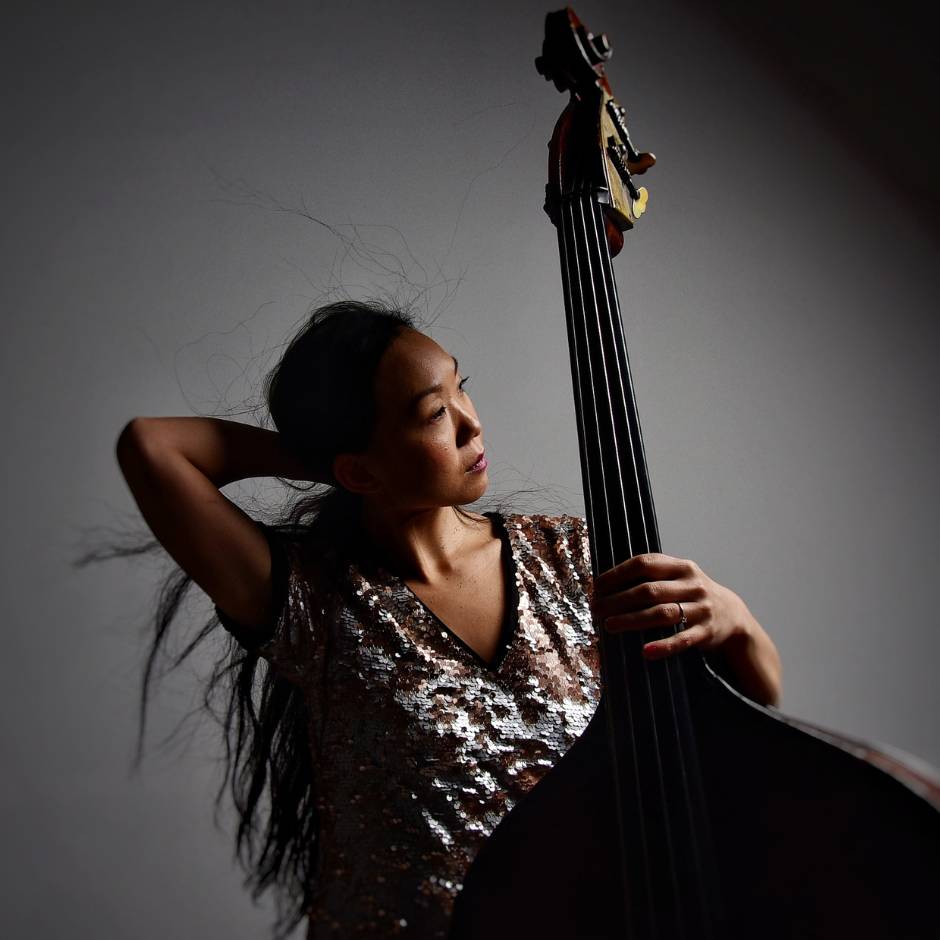 A woman with a bass