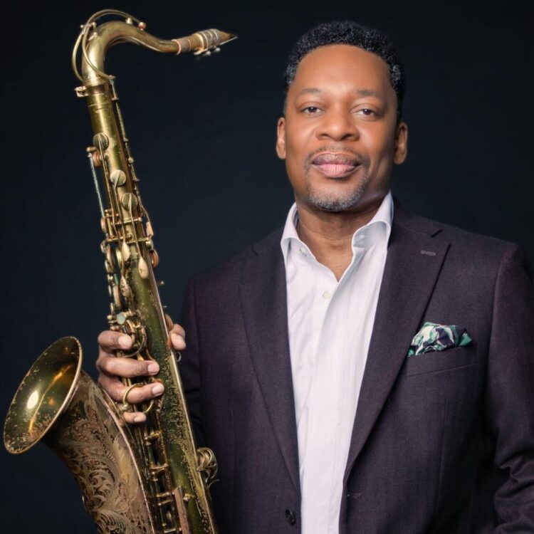 A man holding a saxophone