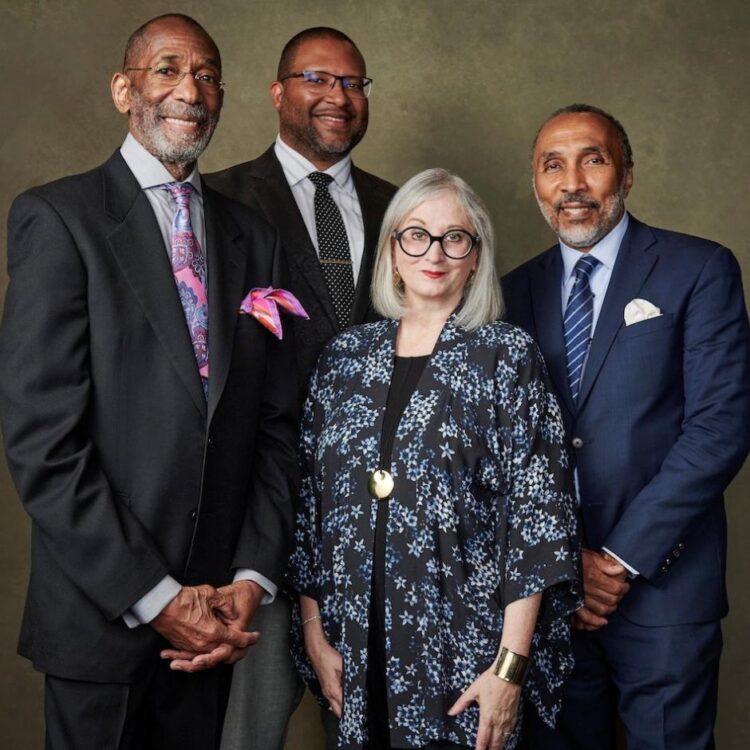 Four people standing