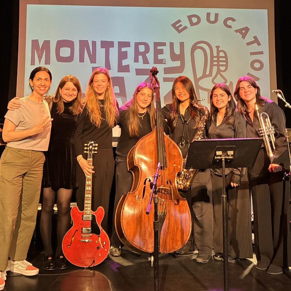 A group of women standing on a stage
