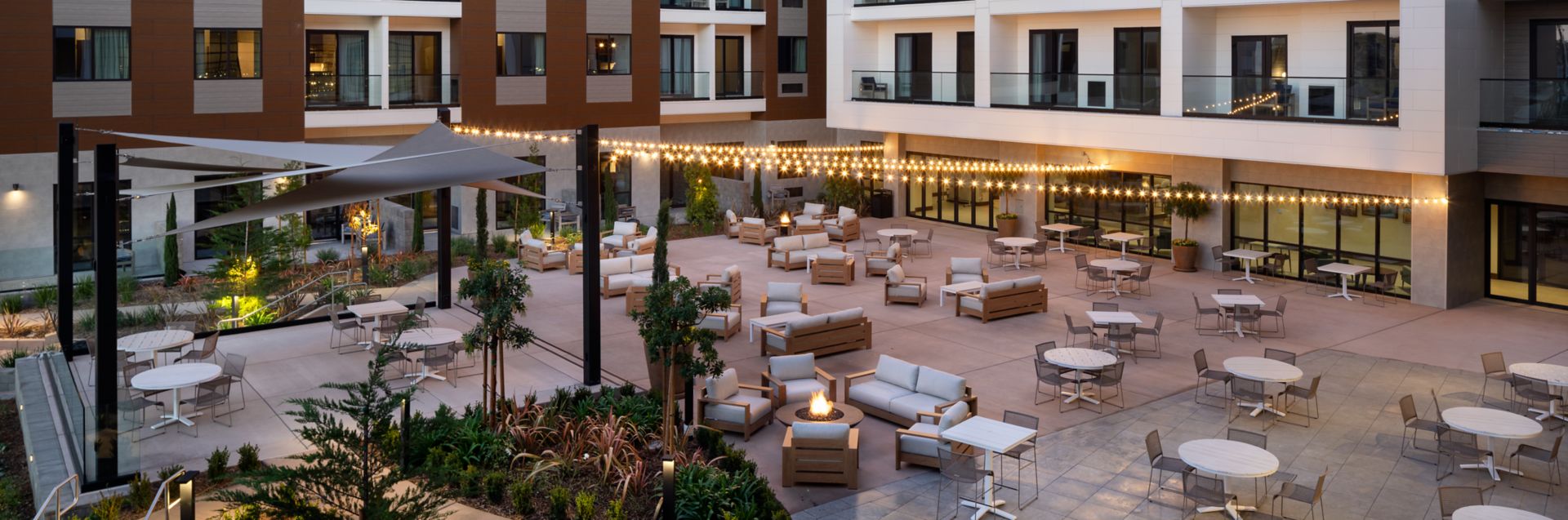 Outside hotel patio with empty furniture