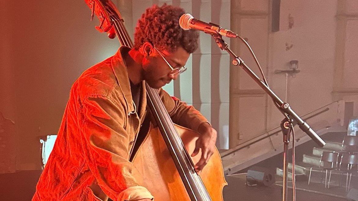 a man playing the bass