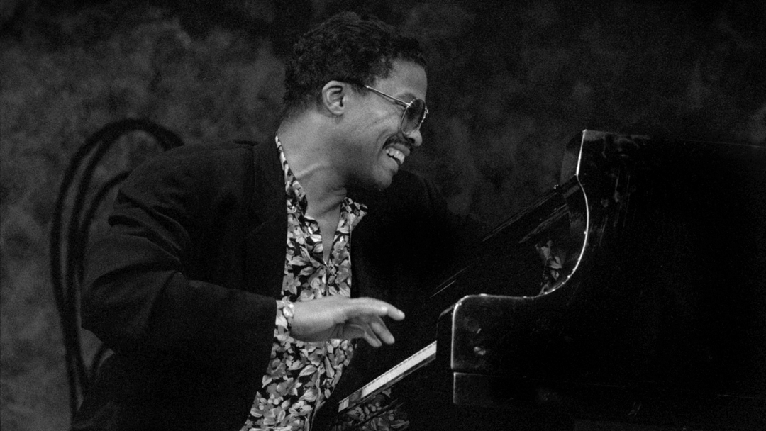 A man sitting at a piano